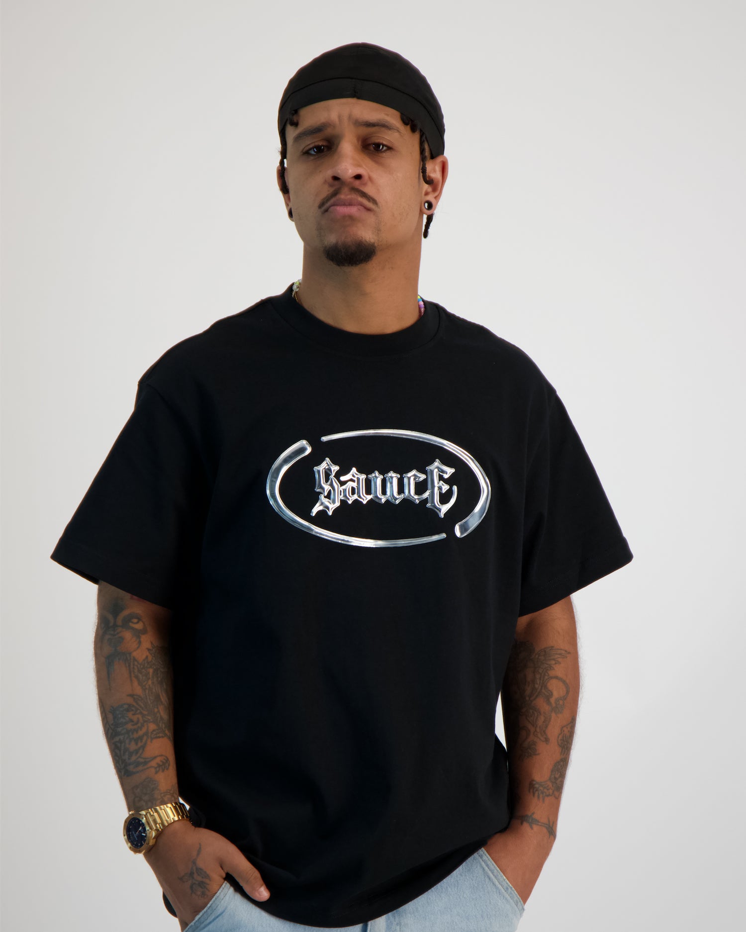 Sauce Model wearing a T -Shirt in Black model from the front 