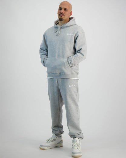 Sauce Tracksuit in Grey and a Model wearing it