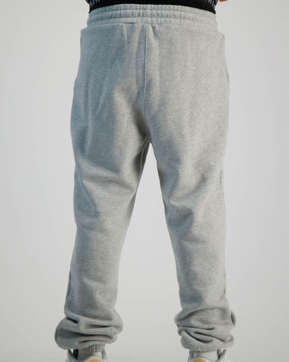 Sauce Tracksuit Pants in Grey and a Model wearing it shot from the Back