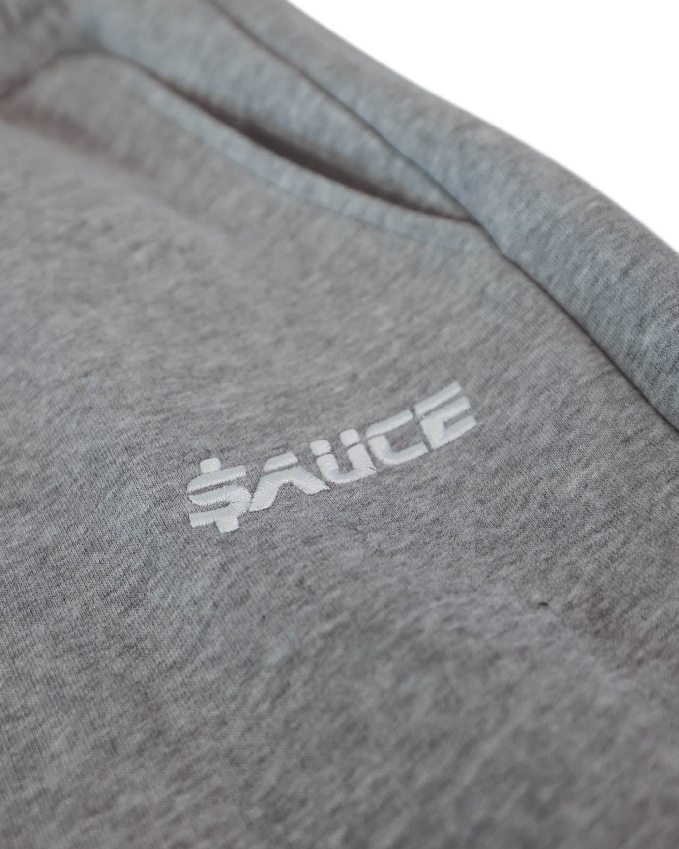 Sauce Tracksuit Pants in Grey Close Up with Logo