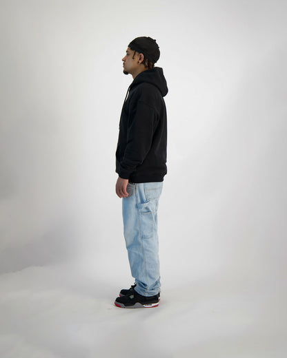 A fullbody shot from the Side of a model wearing Sauce Hoodie